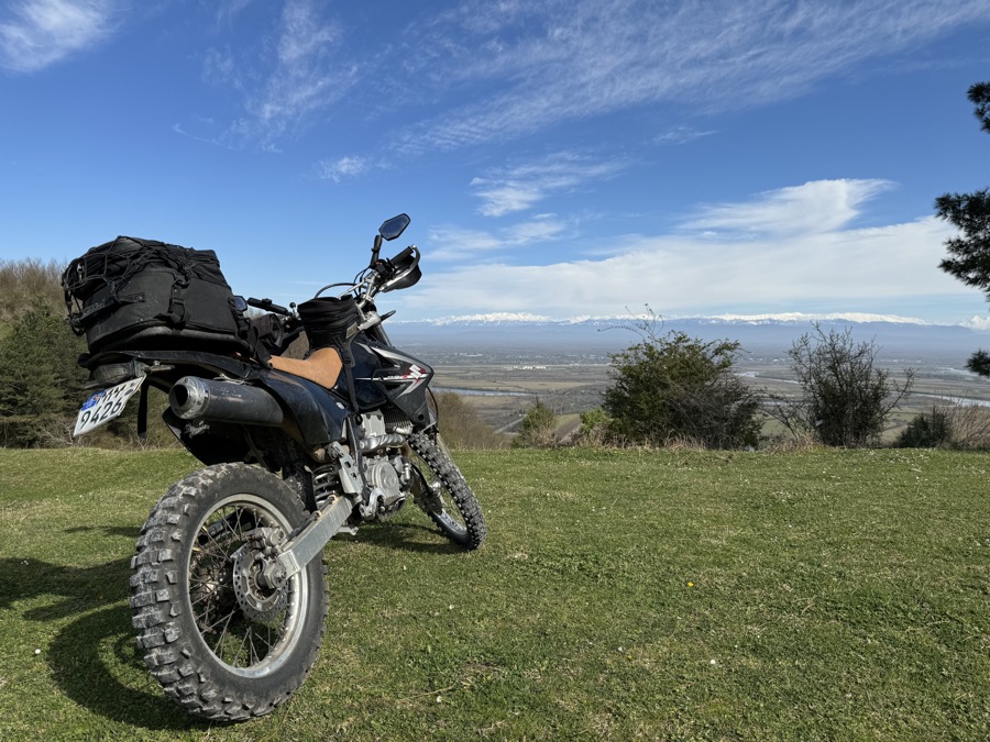 Suzuki DR-Z400S overlooking a Georgian valley and mountains