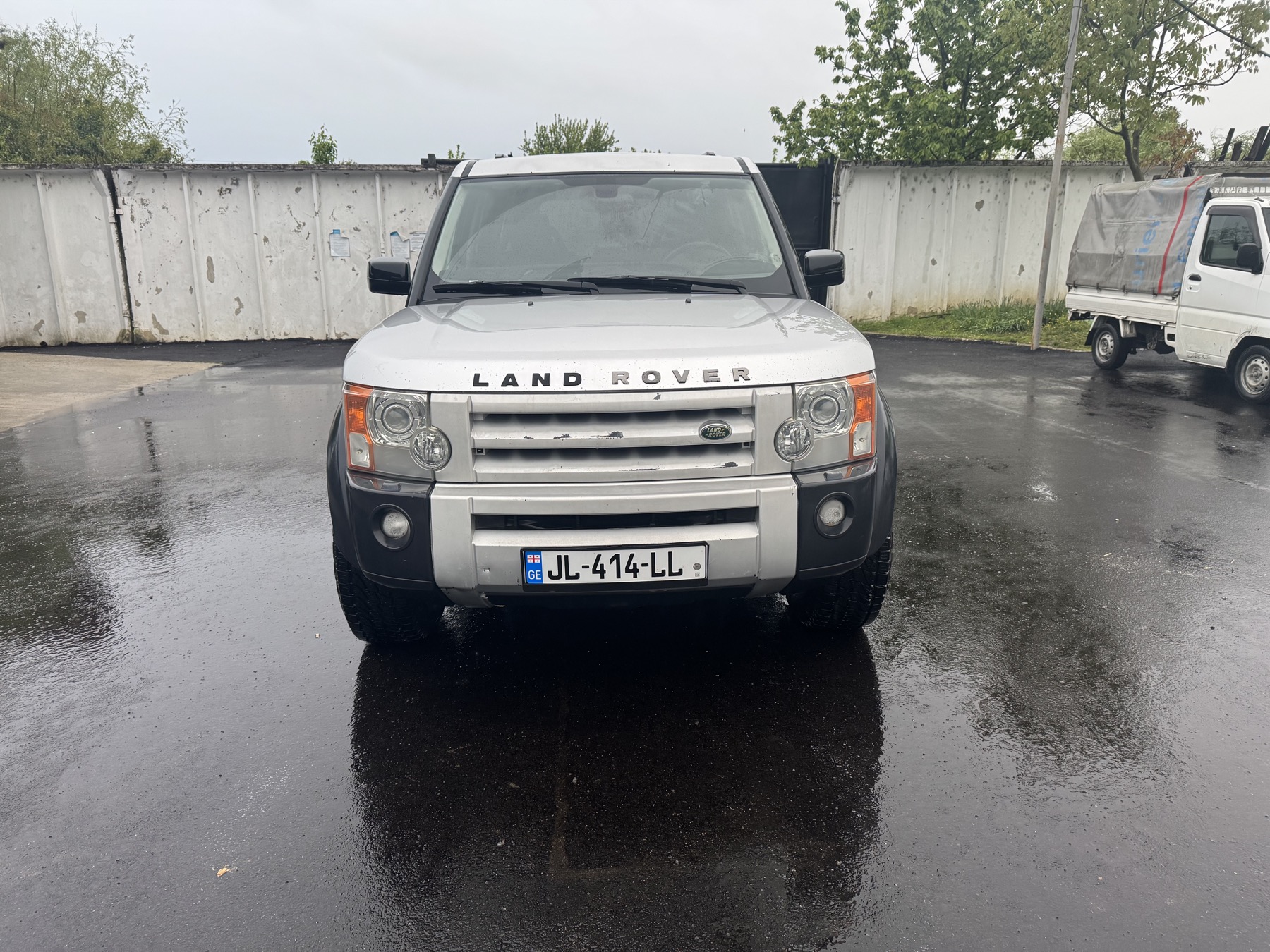 Land Rover LR3 front view on wet pavement