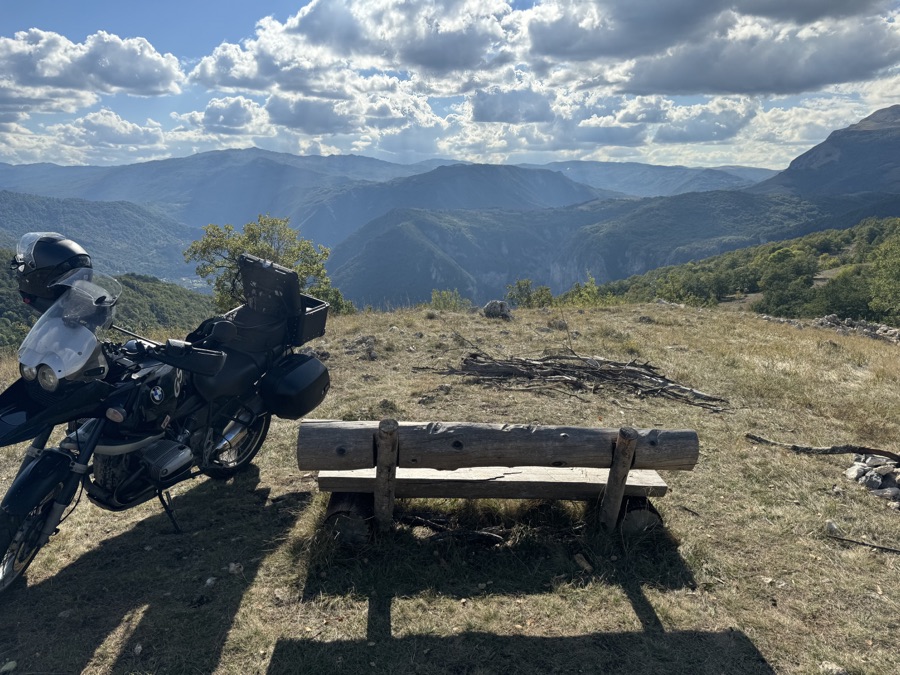 BMW R1150GS parked beside a mountain viewpoint