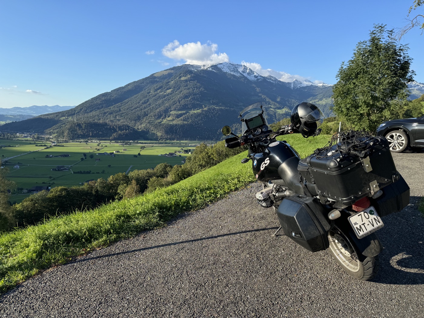2002 BMW R1150GS loaded with luggage overlooking mountain valleys
